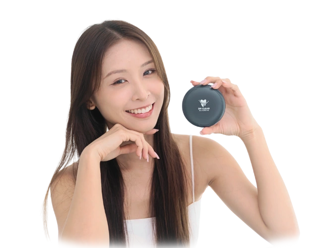 Smiling woman holding Dr Clear Aligners case, symbolizing confidence and lifetime smile guarantee in Malaysia